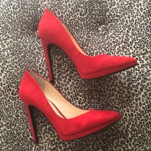 Red suede pumps